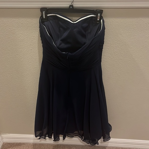 A dark blue strapless dress. It is simple and super cute! - Picture 2 of 3
